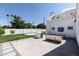 Outdoor kitchen and seating area, adjacent to a grassy backyard at 6140 E Calle Tuberia --, Scottsdale, AZ 85251