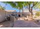 Outdoor patio with built-in BBQ and fire pit at 6216 W Morrow Dr, Glendale, AZ 85308