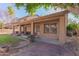 Covered patio with seating area and lush lawn at 6216 W Morrow Dr, Glendale, AZ 85308