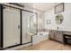 Modern bathroom with a large shower and soaking tub at 6216 W Morrow Dr, Glendale, AZ 85308