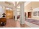 Two-story entryway with double doors and a view into the living room at 6216 W Morrow Dr, Glendale, AZ 85308