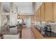 Bright kitchen boasts stainless steel appliances, granite counters, ample cabinetry, and a center island at 6216 W Morrow Dr, Glendale, AZ 85308