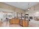 Bright kitchen with a center island, stainless steel dishwasher, and an open view to the living area at 6216 W Morrow Dr, Glendale, AZ 85308