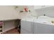 Bright laundry room with washer, dryer, and ample storage at 6216 W Morrow Dr, Glendale, AZ 85308
