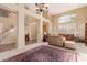 Bright living room with high ceilings and a large area rug at 6216 W Morrow Dr, Glendale, AZ 85308