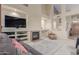 Cozy living room showcases a fireplace, built-in shelving, and a comfortable seating area at 6216 W Morrow Dr, Glendale, AZ 85308
