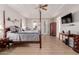 Large main bedroom with a king-size bed and private access to the backyard at 6216 W Morrow Dr, Glendale, AZ 85308
