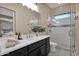 Modern bathroom with a walk-in shower and dark vanity at 6664 S Jacqueline Way, Gilbert, AZ 85298