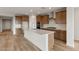 Modern kitchen with an island and herringbone backsplash at 7171 W Oberlin Way, Peoria, AZ 85383