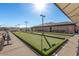 Community bocce ball court with benches and shade at 8144 E Kilarea Ave, Mesa, AZ 85209