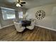 Charming dining area with a dark wood table, comfortable seating, and stylish decor at 8144 E Kilarea Ave, Mesa, AZ 85209