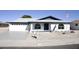 Charming single story home with a well maintained front yard at 8144 E Kilarea Ave, Mesa, AZ 85209