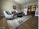 Spacious living room featuring a vaulted ceiling, elegant rug, and plenty of natural light at 8144 E Kilarea Ave, Mesa, AZ 85209