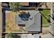 An aerial view of a single-Gathering home featuring a well-maintained lawn, a covered patio, and mature trees at 914 N Cameron Ave, Casa Grande, AZ 85122