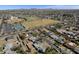 Aerial view of neighborhood with sports complex, mature trees and local streets at 914 N Cameron Ave, Casa Grande, AZ 85122