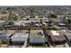 Aerial view of homes with green lawns, block fencing and mature trees at 914 N Cameron Ave, Casa Grande, AZ 85122