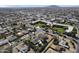 Expansive aerial view of a residential neighborhood with lush green lawns and a mix of single and multi-Gathering homes at 914 N Cameron Ave, Casa Grande, AZ 85122