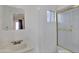 Bright bathroom features a walk-in shower with gold trim and a white vanity sink at 914 N Cameron Ave, Casa Grande, AZ 85122
