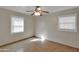 Bedroom with two windows, neutral color walls, tile floor, and ceiling fan at 914 N Cameron Ave, Casa Grande, AZ 85122