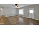 Cozy living room featuring tile flooring, and a door and window with plantation shutters at 914 N Cameron Ave, Casa Grande, AZ 85122
