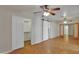 Spacious bedroom featuring parquet floors, multiple ceiling fans, and a sliding barn door at 914 N Cameron Ave, Casa Grande, AZ 85122