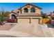 Two-story house with three-car garage and lush landscaping at 9915 N 57Th Ln, Glendale, AZ 85302