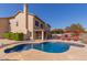 Resort-style pool with lounge chairs and patio umbrellas at 9915 N 57Th Ln, Glendale, AZ 85302