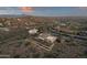 Aerial view of luxury home in desert mountain community at sunset at 10031 N Palisades Blvd, Fountain Hills, AZ 85268