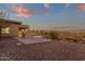 Landscaped backyard with fire pit and city views at 10031 N Palisades Blvd, Fountain Hills, AZ 85268