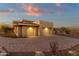 Two-car garage with paver driveway and desert landscaping at 10031 N Palisades Blvd, Fountain Hills, AZ 85268