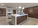 Modern kitchen with a large island, white countertops, and dark brown cabinets at 10031 N Palisades Blvd, Fountain Hills, AZ 85268