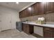 Bright laundry room with ample counter space and storage at 10031 N Palisades Blvd, Fountain Hills, AZ 85268