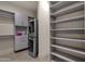 Spacious laundry room with washer, dryer, and ample shelving at 10031 N Palisades Blvd, Fountain Hills, AZ 85268