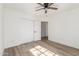 Charming bedroom with wood-look floors and sliding door closet at 1018 S Butte Ave, Tempe, AZ 85281