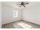 Spacious bedroom featuring wood-look floors and ceiling fan at 1018 S Butte Ave, Tempe, AZ 85281