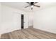 Empty bedroom features closet and wood-look floors at 1018 S Butte Ave, Tempe, AZ 85281