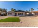 Newly renovated single story home with artificial turf lawn and updated landscaping at 1018 S Butte Ave, Tempe, AZ 85281