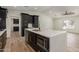 Modern kitchen with island, stainless steel appliances, and dark cabinetry at 1018 S Butte Ave, Tempe, AZ 85281