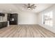 Open concept living room and kitchen with luxury vinyl plank flooring at 1018 S Butte Ave, Tempe, AZ 85281