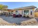 Desert landscaping with covered patio and seating area at 10356 W Ross Ave, Peoria, AZ 85382