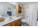 Bathroom with tub, toilet and wood vanity at 10356 W Ross Ave, Peoria, AZ 85382