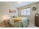 Bedroom with window shutters and decorative wall art at 10356 W Ross Ave, Peoria, AZ 85382