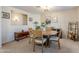 Bright dining room with round table and chairs, neutral decor at 10356 W Ross Ave, Peoria, AZ 85382