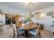 Dining room with round table and chairs, view into kitchen at 10356 W Ross Ave, Peoria, AZ 85382