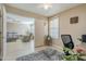 Spacious home office with view into adjacent living room at 10356 W Ross Ave, Peoria, AZ 85382