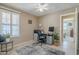 Bright home office features built-in shelving and window shutters at 10356 W Ross Ave, Peoria, AZ 85382