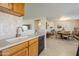 Kitchen features double sink, wood cabinets, and black appliances at 10356 W Ross Ave, Peoria, AZ 85382