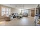 Living room with tile floors, neutral walls, and ample natural light at 10356 W Ross Ave, Peoria, AZ 85382