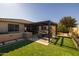 Landscaped backyard with pergola and patio furniture at 10556 E Relativity Ave, Mesa, AZ 85212