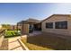 Covered patio with built-in grill and artificial turf at 10556 E Relativity Ave, Mesa, AZ 85212